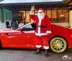 Santa near a Ferrari