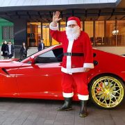 Santa near a Ferrari